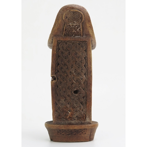 1146 - A Boni or Somali carved wood headrest, of traditional design, with entwined knotted carved panels.18... 