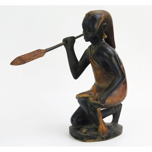 1150 - An African Carved Wooden 
Model of a hunter with spear, signed John Ngony, 32cm tall