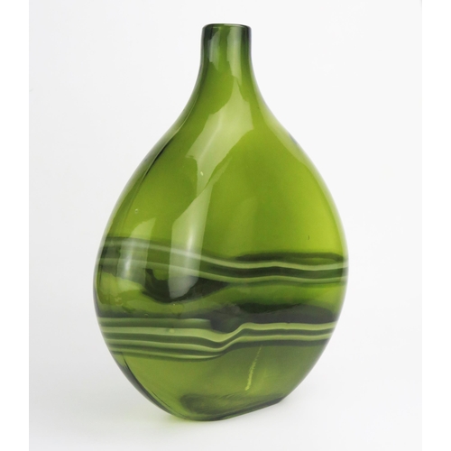 1157 - A modernist green glass bottle vase, of traditional design with variegated wave decoration, 34cm hig... 