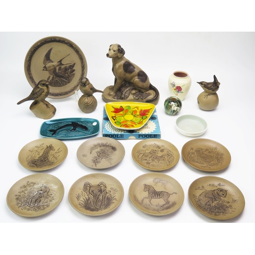 1174 - A collection of Poole pottery animal figure, animal decorated plates, and other ceramics