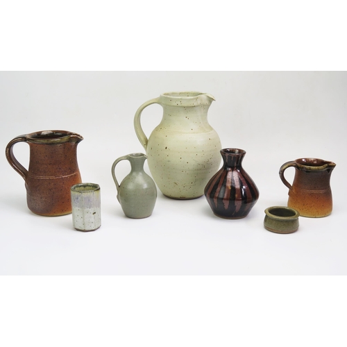 1179 - Ray Finch, a ribbed pale green glaze jug, impressed mark, 21cm high, a smaller jug, impressed mark 1... 