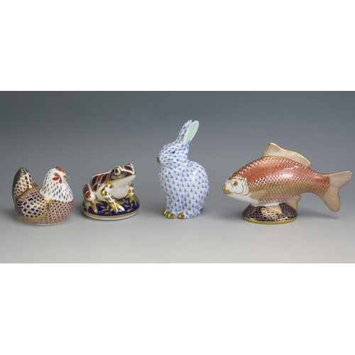 1196 - A Herend porcelain hare, 14cm high, a Royal Crown Derby porcelain fish, 17cm long, a chicken and a p... 