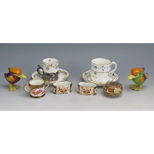 1197 - A pair of Royal Crown Derby napkin  rings, miniature loving cup, coffee cans etc.