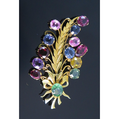 120 - A Multi Stone Foliate Spray Brooch in a precious yellow metal setting, c. 54.6mm high, KEE tests as ... 