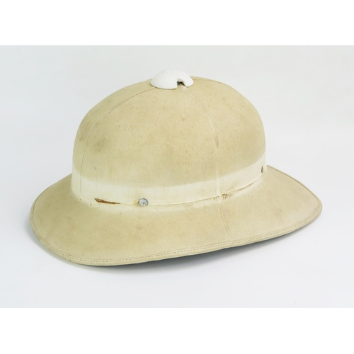 1201 - A 20th century pith helmet by B.W.Vero & Co, stamped 7.1/4 to the helmet and stamped 7 to the head b... 