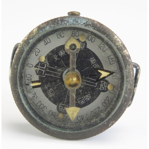 1202A - A world War II period Japanese officer's wrist compass, lacks strap.