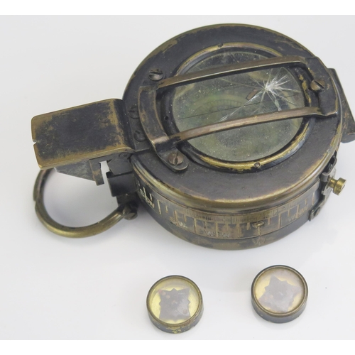 1202D - A World War II British army issue Mk III hand held compass, dated 1942, together with two RAF evasio... 