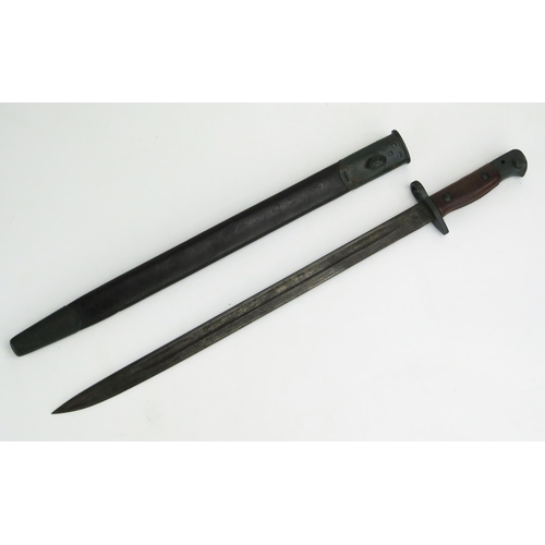 1203 - A British 1907 pattern bayonet, with 43cm fullered blade, with wood grips, contained in a leather sh... 