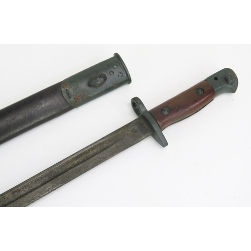 1203 - A British 1907 pattern bayonet, with 43cm fullered blade, with wood grips, contained in a leather sh... 