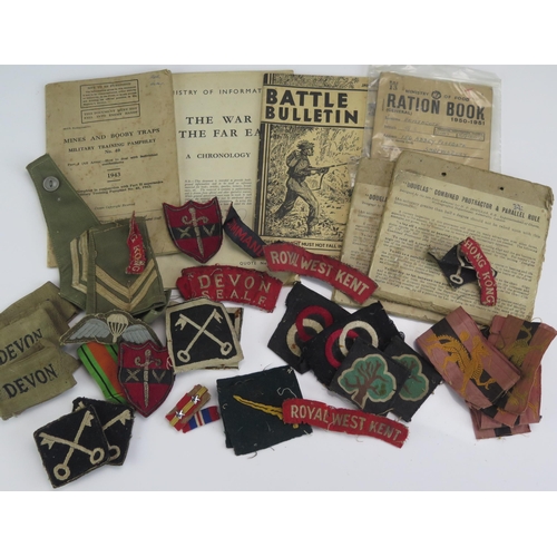 1204B - A collection of assorted military cloth badges, two Douglas combination protractor and parallel rule... 