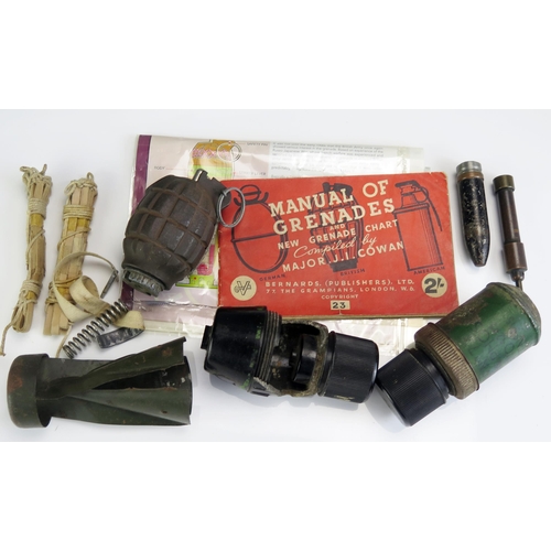 1204D - A practice Mills grenade, a Phosphorus grenade, tail fin of a German incendiary bomb, trip alarms, c... 