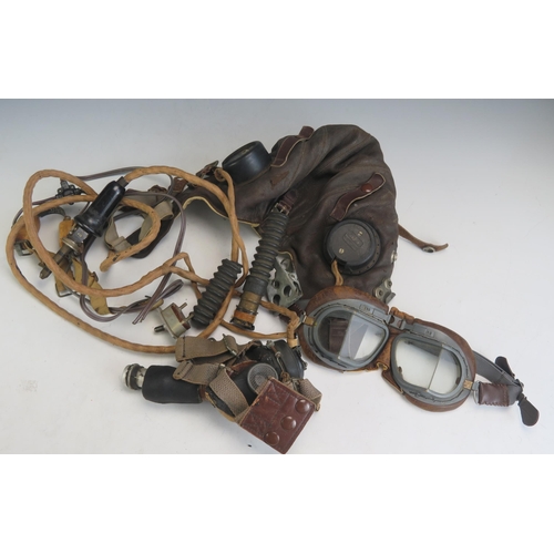 1204E - A British B type flying helmet, with oxygen mask, a pair of Mk VIII flying goggles and throat microp... 