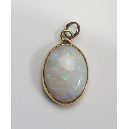 121 - A 9ct Gold and Opal Pendant, 24.3mm drop, hallmarked, 2.11g