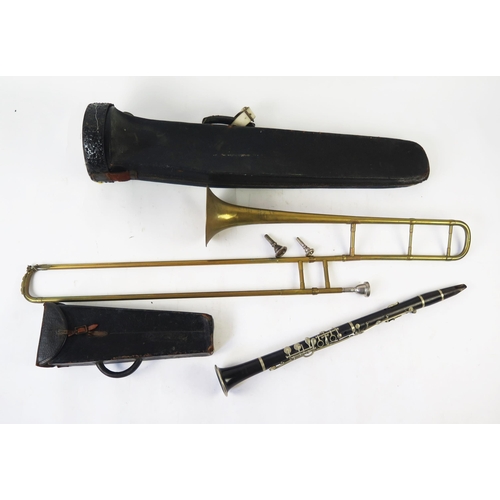 1221 - A Glaccroix Superior G F clarinet, contained in a stitched leather case, a brass trombone with spare... 