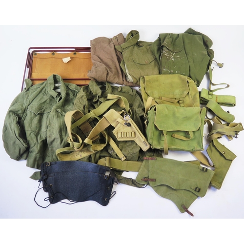 1225 - A collection of British army canvas webbing, holster, belts, gaiters, denim blouses, folding canvas ... 