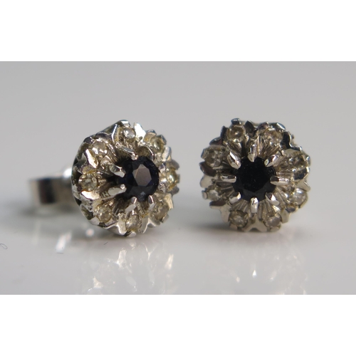 123 - A Pair of 9ct White Gold, Sapphire and Diamond Cluster Earrings, 8.6mm dia., hallmarked, 2.47g