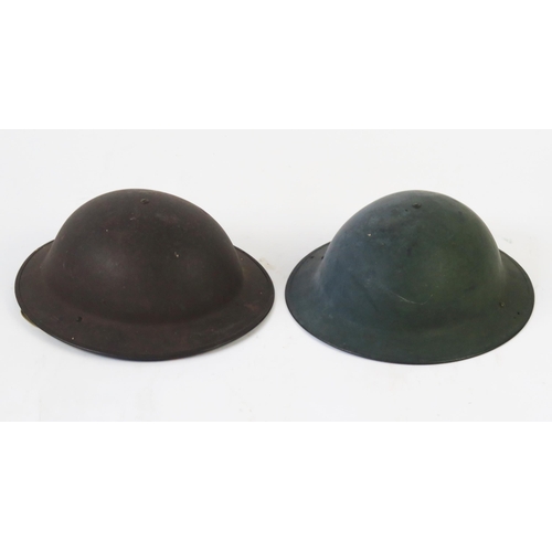 1233 - Two British steel helmets with liners and canvas chin straps.