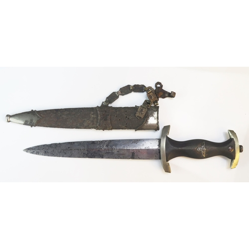 1244A - A Third Reich period SS dagger, with 22cm double edged etched blade, wood grip contained in metal sc... 