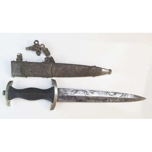 1244A - A Third Reich period SS dagger, with 22cm double edged etched blade, wood grip contained in metal sc... 