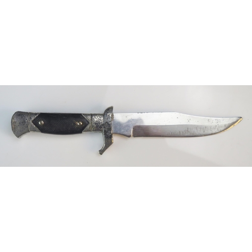 1244B - A replica World War II German fighting knife, with 15cm blade and chequered celluloid grip.  WE DO N... 