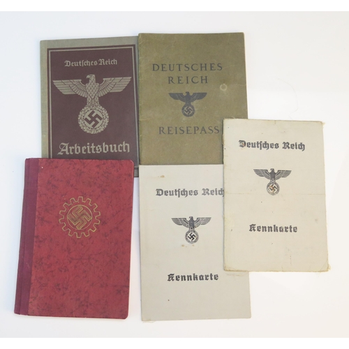 1244F - A Third Reich period passport, two identification papers and ration books.