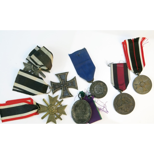 1246B - A World War One Imperial German Iron Cross 2nd class, a Third Reich War Merit Cross 2nd Class with s... 