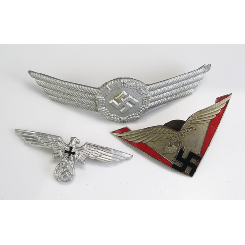 1246D - A Third Reich period Luftwaffe pin badge (1937), a reproduction National Emblem badge (1939), a peak... 