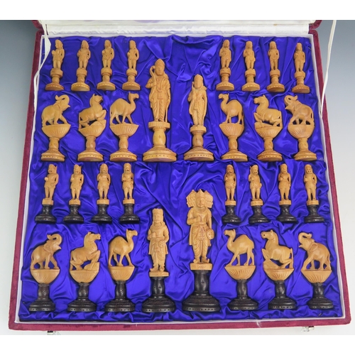 1255 - An Indian carved sandal wood chess set both sides left natural, one side with black bases, contained... 