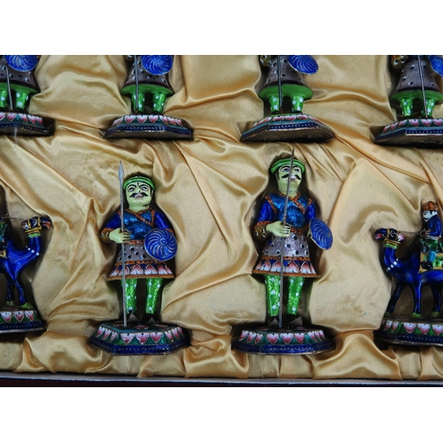 1256 - An Indian metal and enamelled chess set, the pieces modelled as warriors, the king 9.5cm high, the p... 