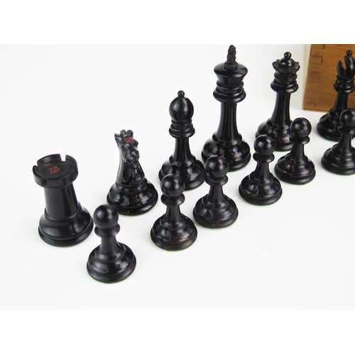 1257 - A 19th century boxwood Staunton pattern chess set one side left natural the other ebonised, the king... 