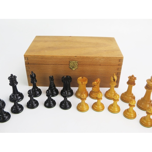 1257 - A 19th century boxwood Staunton pattern chess set one side left natural the other ebonised, the king... 