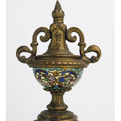 1268 - A late 19th century gilt metal and champlevé enamel mantel clock, of arched outline with urn finial,... 