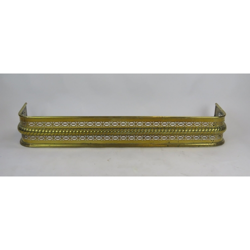 1297 - A 19th century brass fire kerb of rectangular outline, with pierced banded and rope twist decoration... 