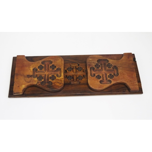 1299 - A Victorian olive wood sliding book rack, in the gothic taste, 
37cm  unextended.