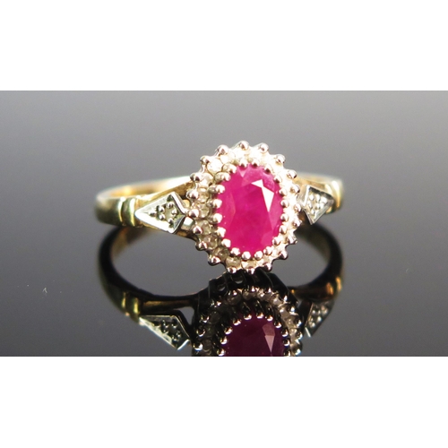 130 - A 9ct Gold, Ruby and Diamond Cluster Ring, size N, hallmarked, 2.64g