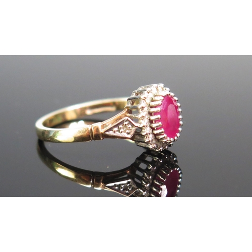 130 - A 9ct Gold, Ruby and Diamond Cluster Ring, size N, hallmarked, 2.64g