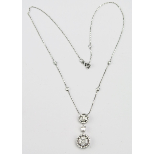 131 - A Middle Eastern 18ct White Gold and Diamond Pendant on integral chain set with brilliant round, pri... 