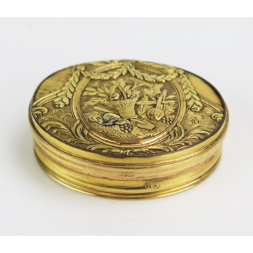 1310 - A late 18th / early 19th century gilt copper patch box, of oval outline, the hinged lid decorated wi... 