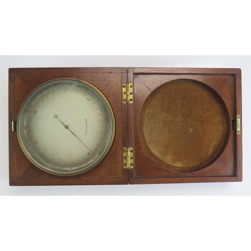 1315B - A 19th century lacquered brass barometer, with 11cm silvered dial, contained in a mahogany case,