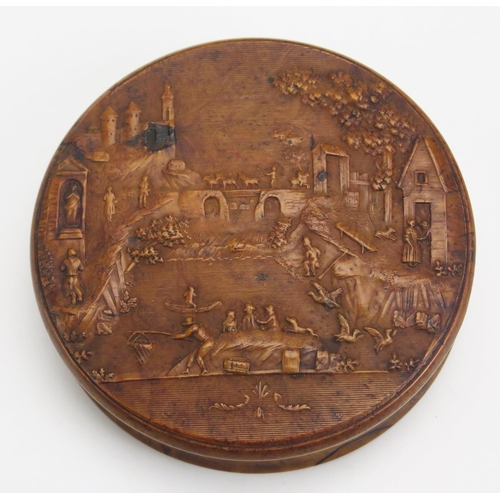 1317 - A 19th century pressed maple snuff box, of circular form the lid decorated with a riverside village ... 