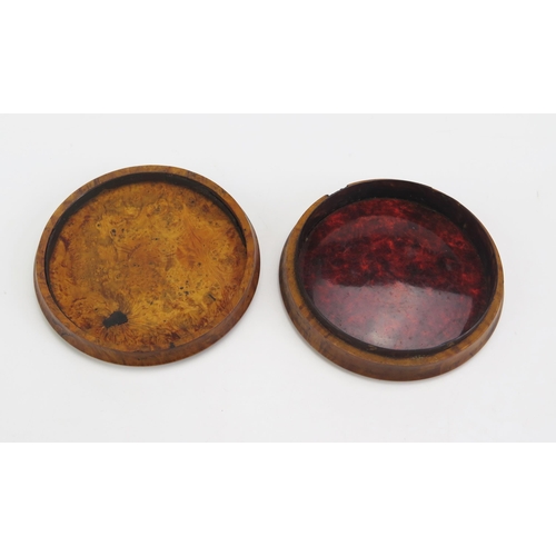 1317 - A 19th century pressed maple snuff box, of circular form the lid decorated with a riverside village ... 