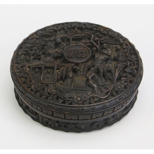 1327 - A 19th century Chinese carved tortoiseshell snuff box of circular form, with all over decoration of ... 