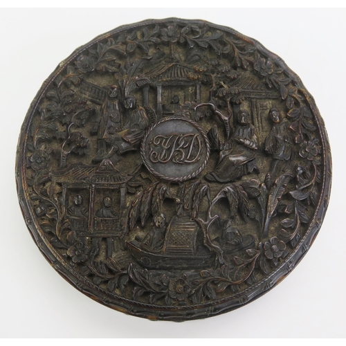 1327 - A 19th century Chinese carved tortoiseshell snuff box of circular form, with all over decoration of ... 