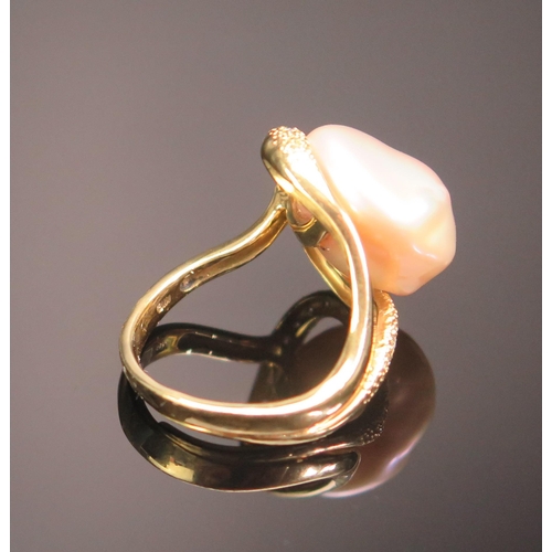 133 - An 18ct Gold, Baroque Pearl or Cultured Pearl and Diamond Ring, 19.5mm head, stamped 18K, .2ct of di... 