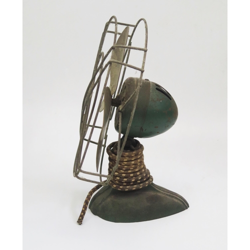 1336 - A 1950's Ergo electric fan, with alloy blades and green painted base. (sold as a collector's item on... 