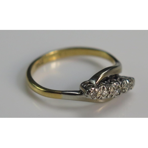 137 - An 18ct Gold and Diamond Five Stone Ring in a platinum setting, size K.5, 2.7g