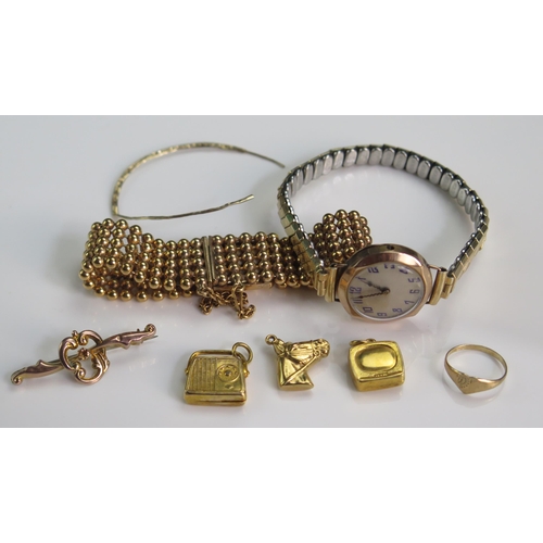 143 - Three 9ct Gold Charms (hallmarked, 3.6g), a 9ct gold brooch (.89g), 9ct gold baby's ring (size E, .6... 