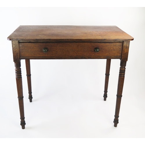 1510 - A 19th century oak side table, with a rectangular top and single frieze drawer, raised on four ring ... 