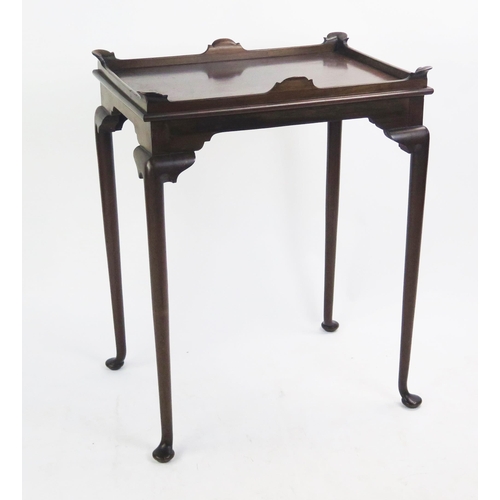 1511 - A Mahogany silver table with a galleried top,  and a Georgian tilt top table on tripod base.