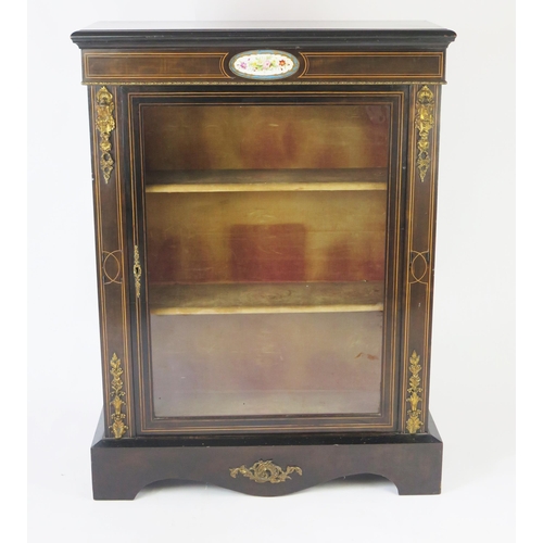 1518 - A 19th century ebonised, rosewood, and gilt metal mounted pier cabinet, the rectangular top, above a... 